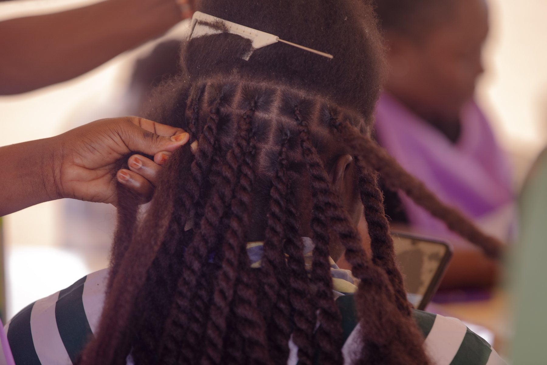 Détail de tresses pendant l'événement